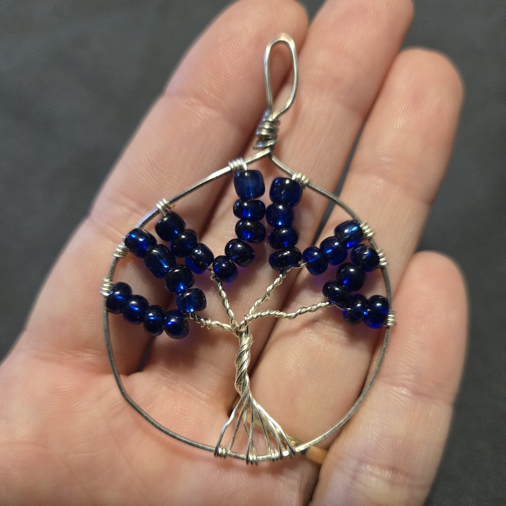 Elegant Silver and Blue Tree Pendant